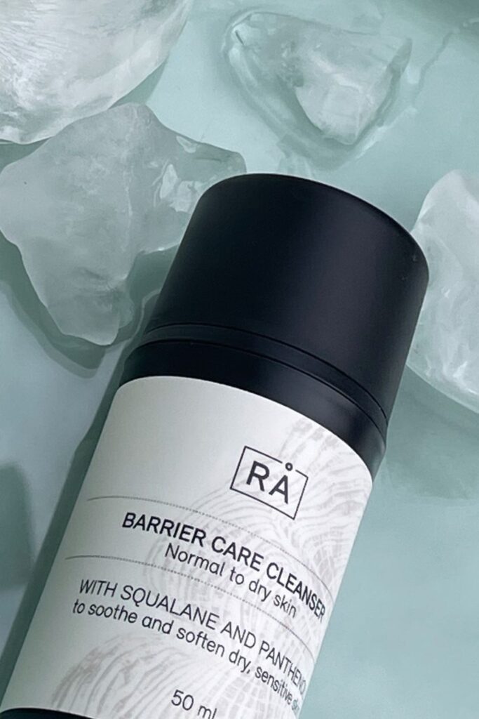 Cleansing cream with turquoise ice background