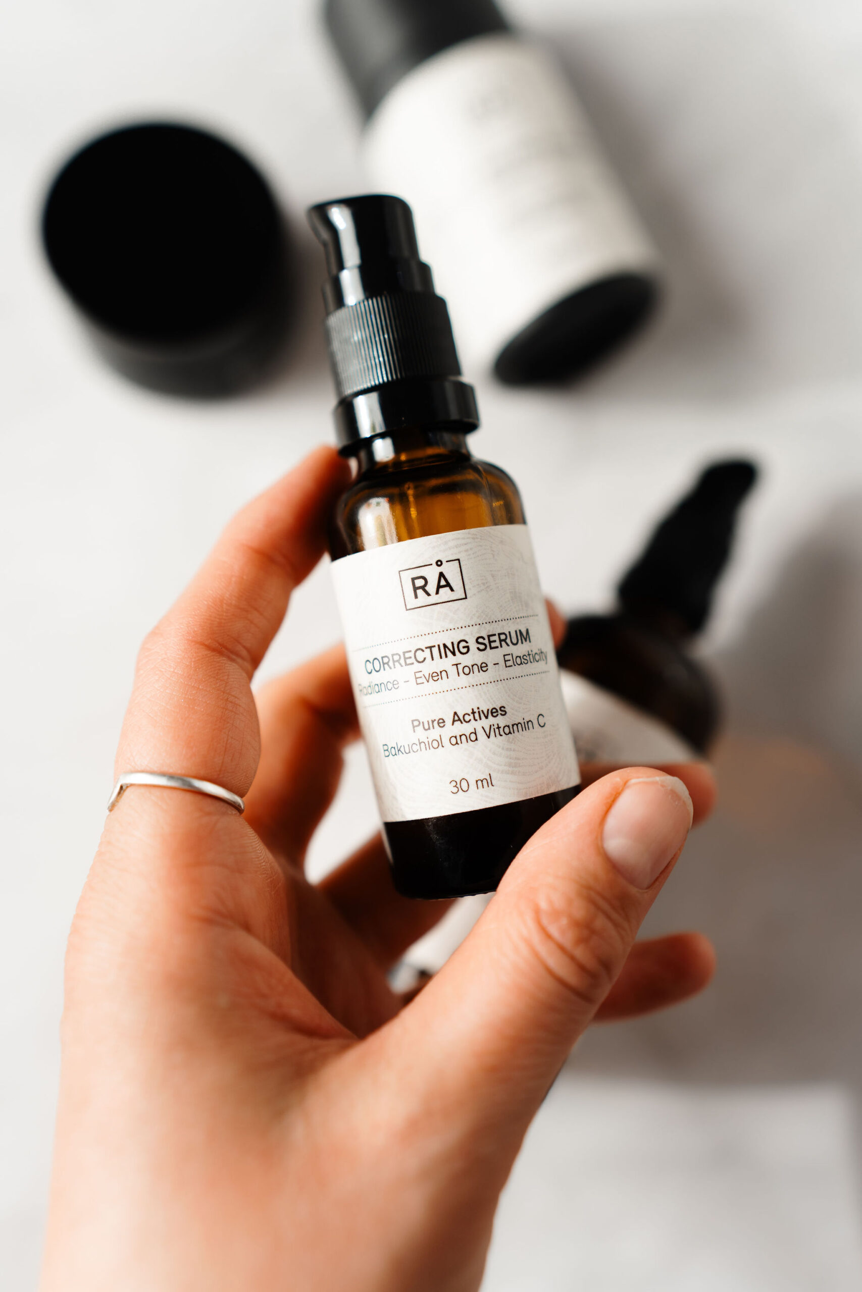 raw correcting serum is held in the hand