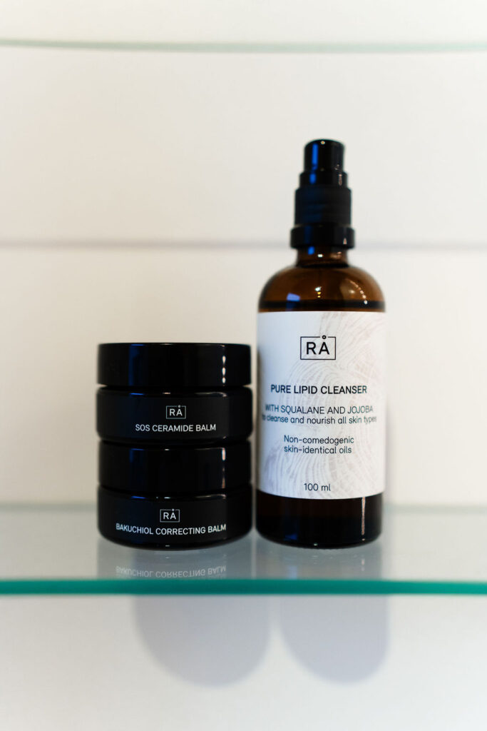 Bakuchiol correcting balm together with Sos ceramide balm and pure lipid cleanser on the bathroom shelf