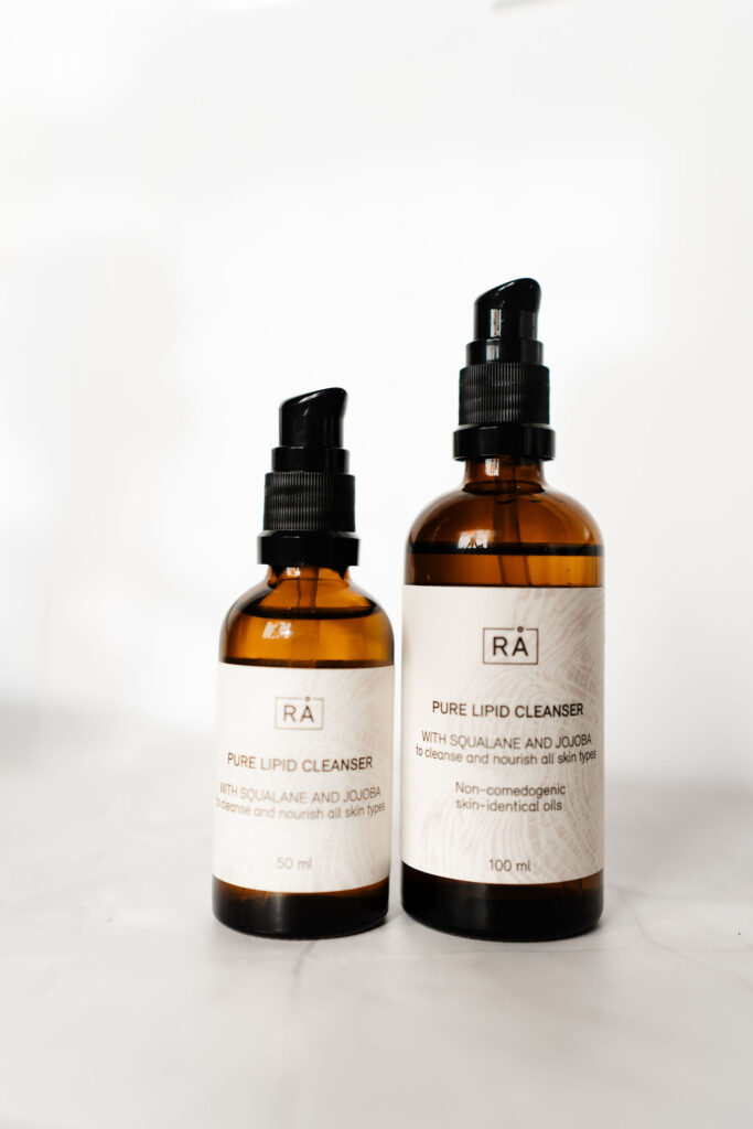 Raw pure lipid cleanser in 50 ml and 100 ml with light background